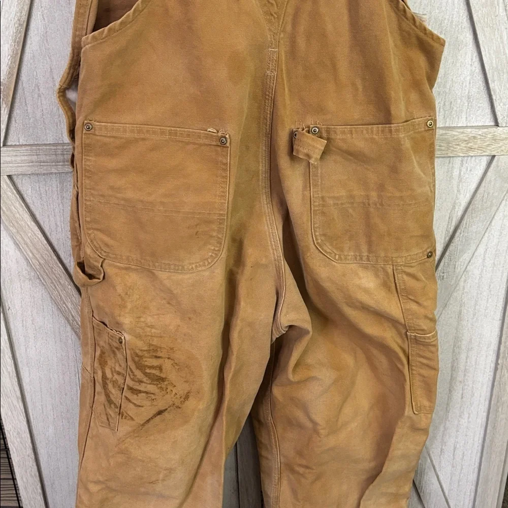 Thrashed vintage 80s or 90s carhartt unlined beige double knee duck overall bibs